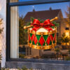 Kerst Raamsticker | Kersttrommel met rode strik en gouden details preview