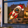 Kerst Raamsticker | Kerstraket met kerstmuts en kerstkrans preview