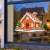 Kerst Raamsticker | Sprookjesachtig peperkoekenhuis met sneeuw preview