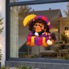 Sinterklaas Raamsticker | Dromerige Piet op een cadeautje preview